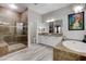 Bathroom with walk-in shower, soaking tub, double vanity, and wood-look flooring at 9349 Olympia Falls Ave, Las Vegas, NV 89149