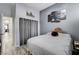 Comfortable bedroom with gray walls, art on the walls, and wood-look flooring at 9349 Olympia Falls Ave, Las Vegas, NV 89149