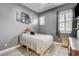 Bedroom with a small bed and a small window at 9349 Olympia Falls Ave, Las Vegas, NV 89149