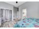 Relaxing bedroom with a ceiling fan and ensuite bathroom, offering a private and comfortable space at 9349 Olympia Falls Ave, Las Vegas, NV 89149