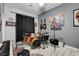 This bonus room is ready to be filled with laughter and music with instruments and speakers ready to play at 9349 Olympia Falls Ave, Las Vegas, NV 89149