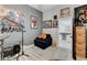 This bonus room with neutral paint features fun art at 9349 Olympia Falls Ave, Las Vegas, NV 89149