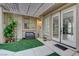 Cozy outdoor courtyard with seating, string lights, and direct access to the home's interior at 9349 Olympia Falls Ave, Las Vegas, NV 89149