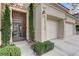 Close-up of the front entrance, showcasing a secure decorative gate and tidy landscaping at 9349 Olympia Falls Ave, Las Vegas, NV 89149
