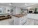Kitchen area showcasing the island, breakfast nook and white cabinets at 9349 Olympia Falls Ave, Las Vegas, NV 89149