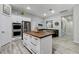 Bright kitchen featuring stainless steel appliances, a kitchen island, and a cozy breakfast nook at 9349 Olympia Falls Ave, Las Vegas, NV 89149