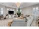 Cozy living room featuring a comfortable sofa, stylish decor, and a relaxing atmosphere at 9349 Olympia Falls Ave, Las Vegas, NV 89149