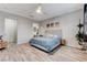 Bright main bedroom features stylish furnishings and seamless access to ensuite bathroom at 9349 Olympia Falls Ave, Las Vegas, NV 89149