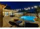 Luxurious backyard pool features spa, umbrellas, and lounge chairs, ideal for outdoor relaxation at 9349 Olympia Falls Ave, Las Vegas, NV 89149