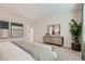 This spacious bedroom features neutral walls and carpets, with stylish accents at 9564 Archer Peak Ct, Las Vegas, NV 89143