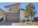 Charming two-story home with a two-car garage and low maintenance desert landscaping in a Gathering-friendly neighborhood at 9564 Archer Peak Ct, Las Vegas, NV 89143