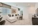 Cozy loft area with a plush sofa, neutral decor, and ample natural light, creating an inviting atmosphere at 9564 Archer Peak Ct, Las Vegas, NV 89143