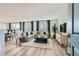 Bright and open living space featuring modern furnishings, stylish decor, and plank flooring with views to the kitchen at 9564 Archer Peak Ct, Las Vegas, NV 89143