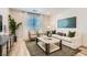 Bright living room with sofa, armchairs, coffee table, and stylish decor at 9564 Archer Peak Ct, Las Vegas, NV 89143