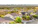 Scenic aerial view shows the community, plus the stunning Las Vegas skyline and distant mountains in the background at 977 Courtney Valley St, Henderson, NV 89052