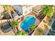 Beautiful backyard oasis with an in-ground pool, spa, and covered patio, ideal for entertaining and relaxation at 977 Courtney Valley St, Henderson, NV 89052
