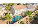 Backyard oasis featuring a sparkling pool, hot tub, covered patio, and privacy, ideal for relaxation and entertainment at 977 Courtney Valley St, Henderson, NV 89052