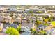 Aerial view of a neighborhood near a high school with a welcome to Cougar Country sign and manicured landscaping at 977 Courtney Valley St, Henderson, NV 89052