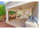 Covered patio with ceiling fans and backyard pool view at 977 Courtney Valley St, Henderson, NV 89052