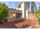 Exterior shot of backyard patio, landscaping, and house at 977 Courtney Valley St, Henderson, NV 89052
