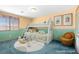 Staged bedroom with bunkbeds, artwork, and orange accent wall at 977 Courtney Valley St, Henderson, NV 89052