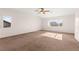 Spacious bedroom with ceiling fan and natural light streaming through the windows at 977 Courtney Valley St, Henderson, NV 89052