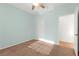 A basic bedroom with ceiling fan, carpet, light-green walls and white doors at 977 Courtney Valley St, Henderson, NV 89052