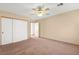 Spacious bedroom with a ceiling fan and closet at 977 Courtney Valley St, Henderson, NV 89052