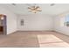 A bonus room with carpet, neutral walls, a ceiling fan, and some natural light at 977 Courtney Valley St, Henderson, NV 89052