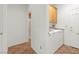 Laundry room with washer, dryer, tile floors and upper wood cabinet at 977 Courtney Valley St, Henderson, NV 89052