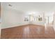 Expansive living area with neutral color palette, tile flooring and backyard views at 977 Courtney Valley St, Henderson, NV 89052