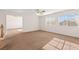 Large living room featuring plush carpet, natural light and open access to other rooms at 977 Courtney Valley St, Henderson, NV 89052
