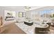 Comfortable living room featuring neutral decor, a ceiling fan, and access to the bedroom at 977 Courtney Valley St, Henderson, NV 89052