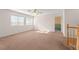 A spacious and light filled living room with plush carpet and ample natural light at 977 Courtney Valley St, Henderson, NV 89052