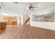 Open floor plan featuring a tile floor, kitchen, staircase, and living room at 977 Courtney Valley St, Henderson, NV 89052