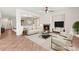 Staged living room with tile floors, fireplace, and modern furniture at 977 Courtney Valley St, Henderson, NV 89052