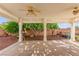 Covered patio with shade, ceiling fans, view of the landscaped backyard at 977 Courtney Valley St, Henderson, NV 89052