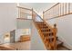 A staircase and landing with wooden railings and carpeted steps at 977 Courtney Valley St, Henderson, NV 89052