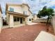 View of the backyard and gravel landscaping of this two story home at 9821 Sedona Shrine Ave, Las Vegas, NV 89148