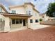 View of the backyard showing the patio and gravel landscaping of this two story home at 9821 Sedona Shrine Ave, Las Vegas, NV 89148