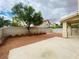 Wide shot of the backyard with gravel landscaping and concrete patio at 9821 Sedona Shrine Ave, Las Vegas, NV 89148