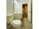 Bright bathroom featuring a toilet, vanity sink, and mirror at 9821 Sedona Shrine Ave, Las Vegas, NV 89148
