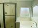 Bathroom featuring a shower and tub at 9821 Sedona Shrine Ave, Las Vegas, NV 89148