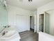 Bright bathroom featuring double sinks, a shower, and a closet for storage at 9821 Sedona Shrine Ave, Las Vegas, NV 89148