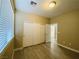 Bedroom with three closets and a window, offering ample storage space and natural light at 9821 Sedona Shrine Ave, Las Vegas, NV 89148