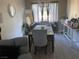 Dining room featuring a large table with seating and natural light at 9821 Sedona Shrine Ave, Las Vegas, NV 89148