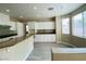 Bright kitchen with granite countertops and white cabinetry at 9821 Sedona Shrine Ave, Las Vegas, NV 89148