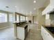 Modern kitchen featuring granite counters, stainless appliances, and a breakfast bar at 9821 Sedona Shrine Ave, Las Vegas, NV 89148