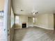 Living room featuring a cozy fireplace and natural light at 9821 Sedona Shrine Ave, Las Vegas, NV 89148