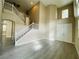 Bright living room with hardwood floors and a staircase at 9821 Sedona Shrine Ave, Las Vegas, NV 89148